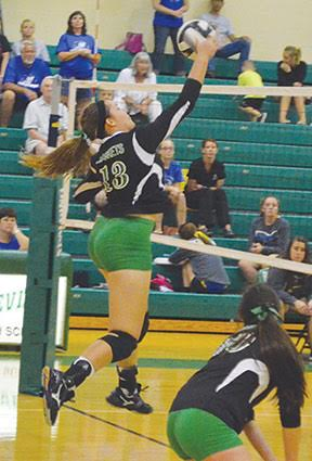 Fayetteville’s Faith Stegbauer hammers down a spike during a Lady Rocket win this season.
