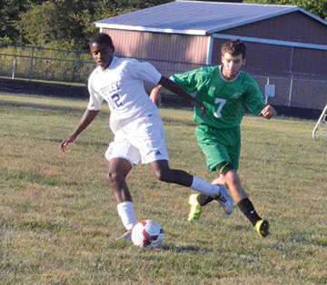 Ripley’s Nigel Royal is on the attack while Fayetteville’s Christian Hansel moves in to defend during the Sept. 20 game at Ripley.