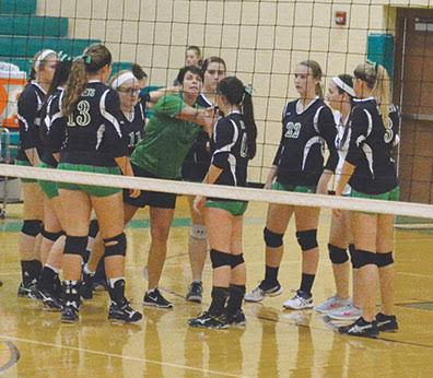 Fayetteville-Perry volleyball coach Sharon Sheets instructs her Lady Rockets during a match this season. 