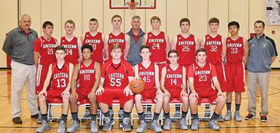 The Eastern Warriors take the court for their 2016-17 basketball campaign. Front row, from the left, are Titus Burns, Marcus Hamilton, Kaleb Martin, Ethan Battson, Gage Boone, and Jordan Johnson; back row, assistant coach Tim Boone, Logan Lainhart, Dakota Hiser, Josh Tolle, Dare Minton, head coach Rob Beucler, Garyn Purdy, Jacob Diener, Blake Rigdon, TJ Stivers, and assistant coach Rich Kelch.